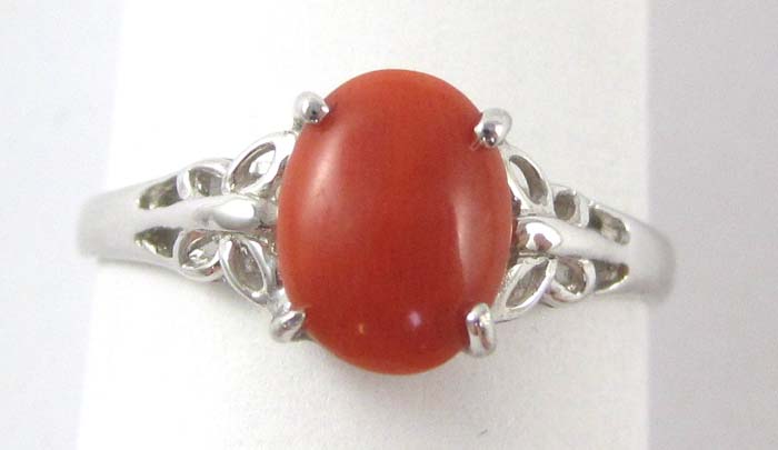 Appraisal: CORAL AND FOURTEEN KARAT GOLD RING The white gold ring