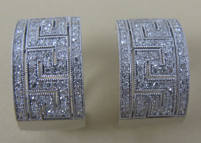 Appraisal: PAIR OF DIAMOND EARRINGS The top half of each k