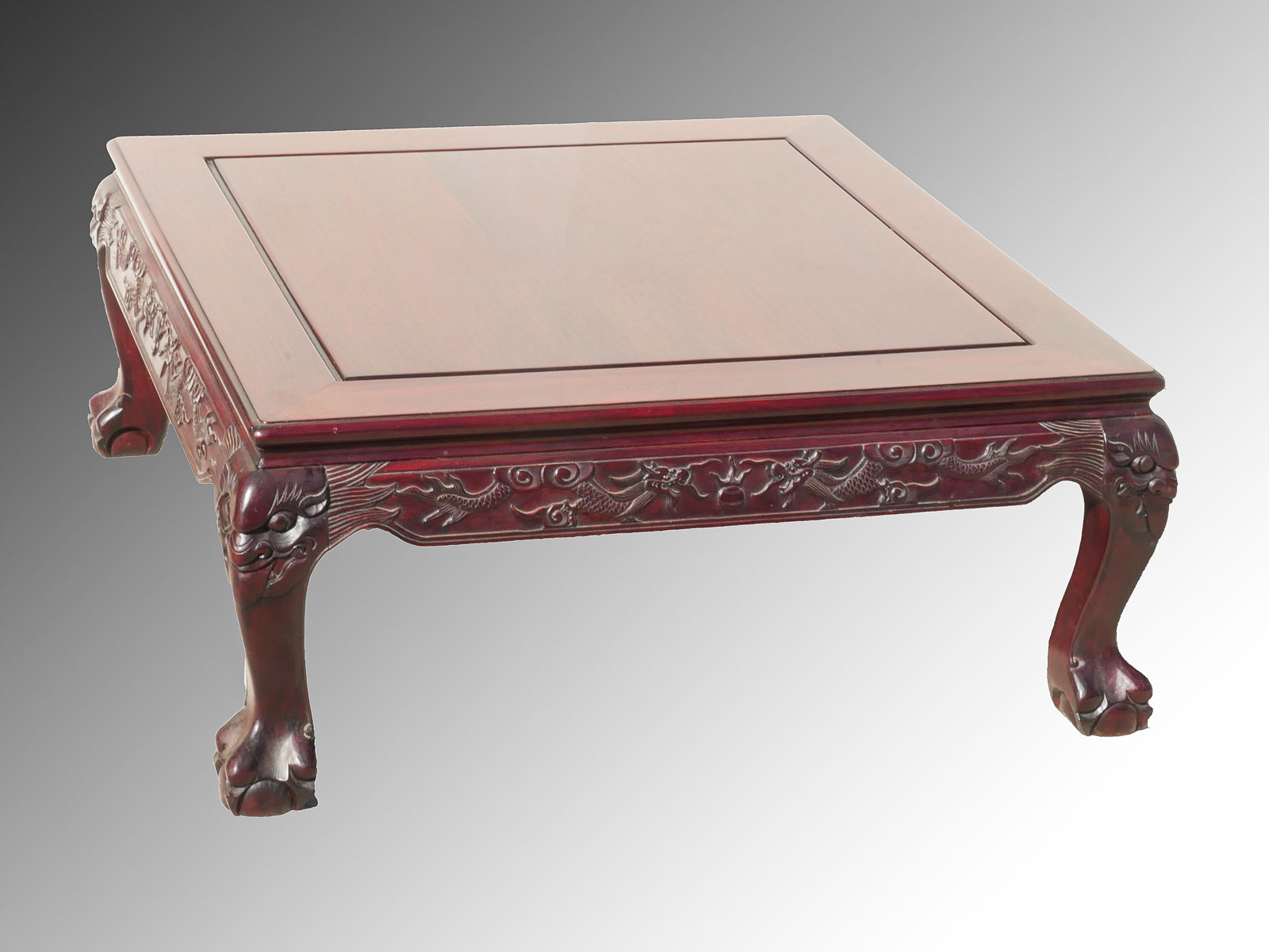 Appraisal: CARVED CHINESE ROSEWOOD COFFEE TABLE Having carved Dragon aprons raised