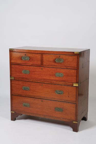 Appraisal: A MAHOGANY CAMPAIGN CHEST in two parts the rectangular top