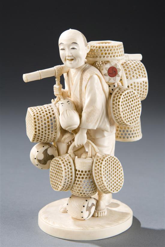 Appraisal: Japanese ivory carving of a peddler Late th early th