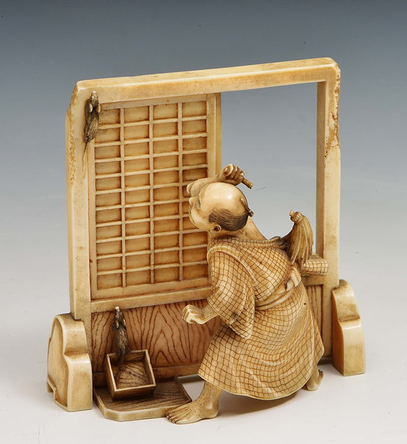 Appraisal: A Japanese ivory okimono of a disappointed rat catcherMeiji periodsigned