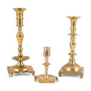 Appraisal: Three Continental Brass Candlesticks th Century Height of tallest inches