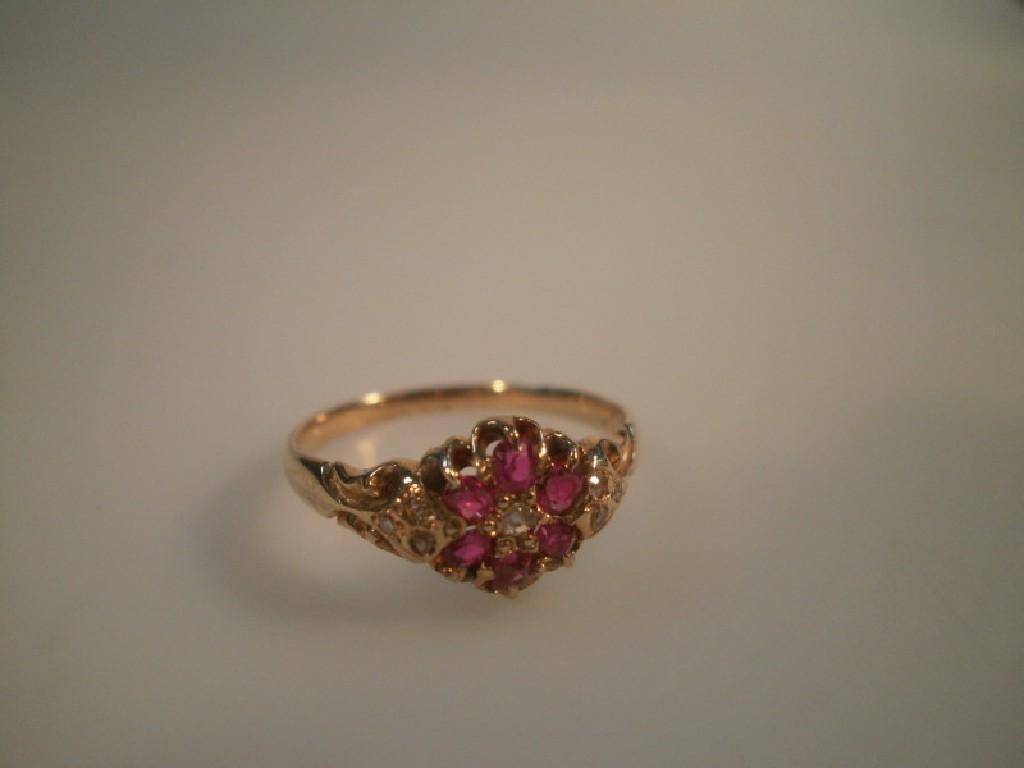 Appraisal: A Victorian style floral cluster ring set with small rubies