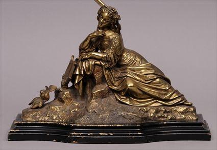 Appraisal: CONTINENTAL GILT-METAL FIGURE OF A RECLINING MUSE WITH LYRE MOUNTED