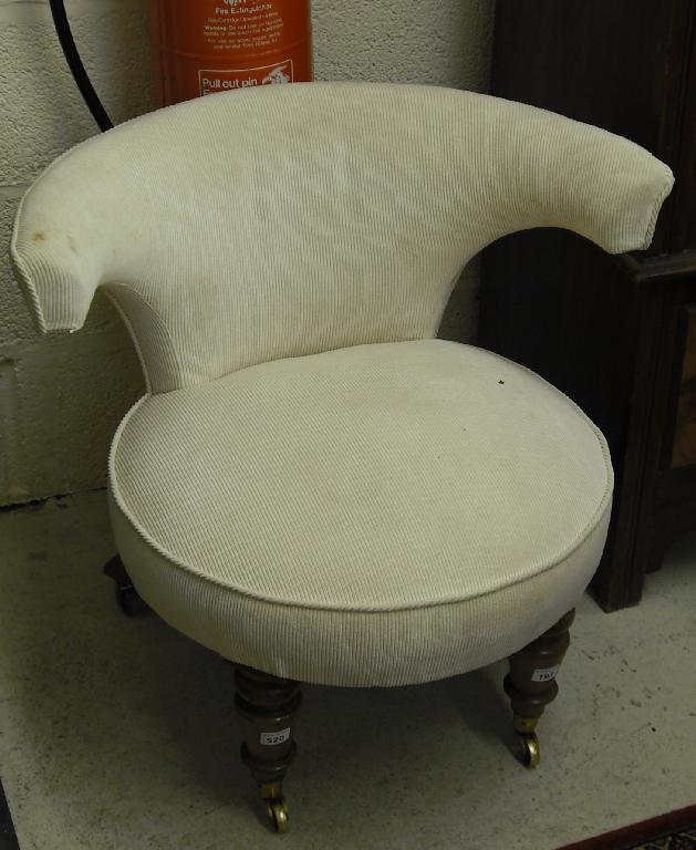 Appraisal: Victorian cream upholstered tub chair upon turned legs with brass