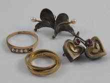 Appraisal: A mixed lot comprising a ct gold ''Russian'' wedding ring