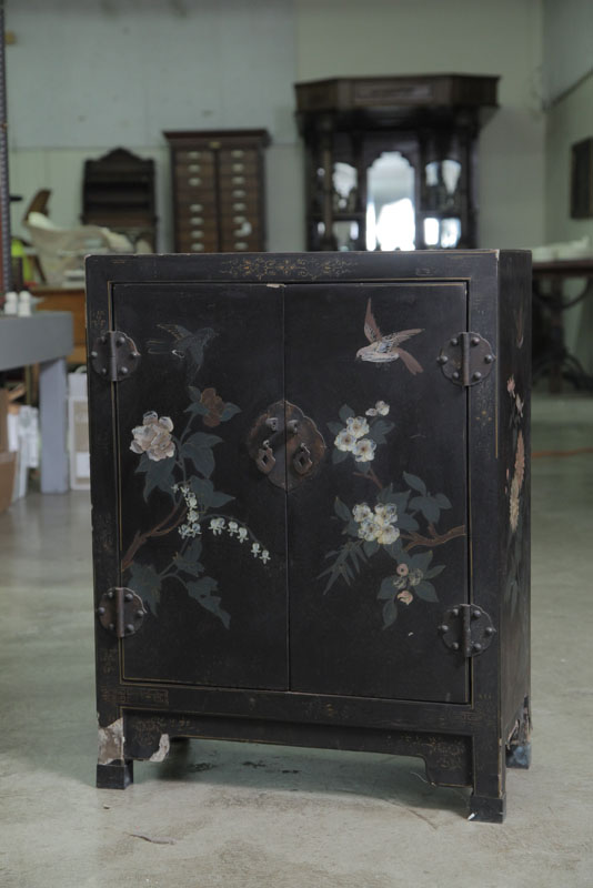 Appraisal: PAIR OF ORIENTAL CABINETS Black laquered cabinets with floral and