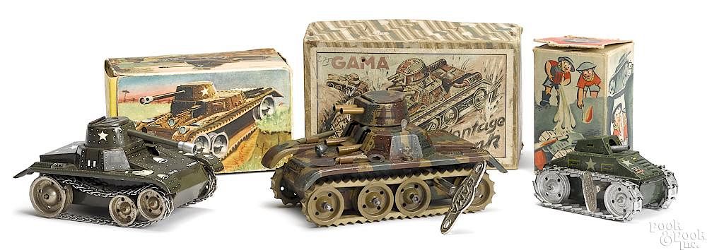 Appraisal: Three tin lithograph clockwork German tanks Three tin lithograph clockwork