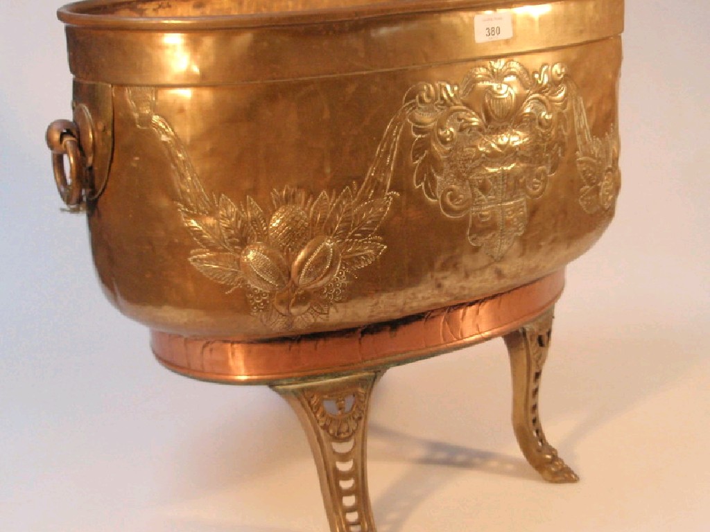 Appraisal: A brass and copper oval planter with ring handles and