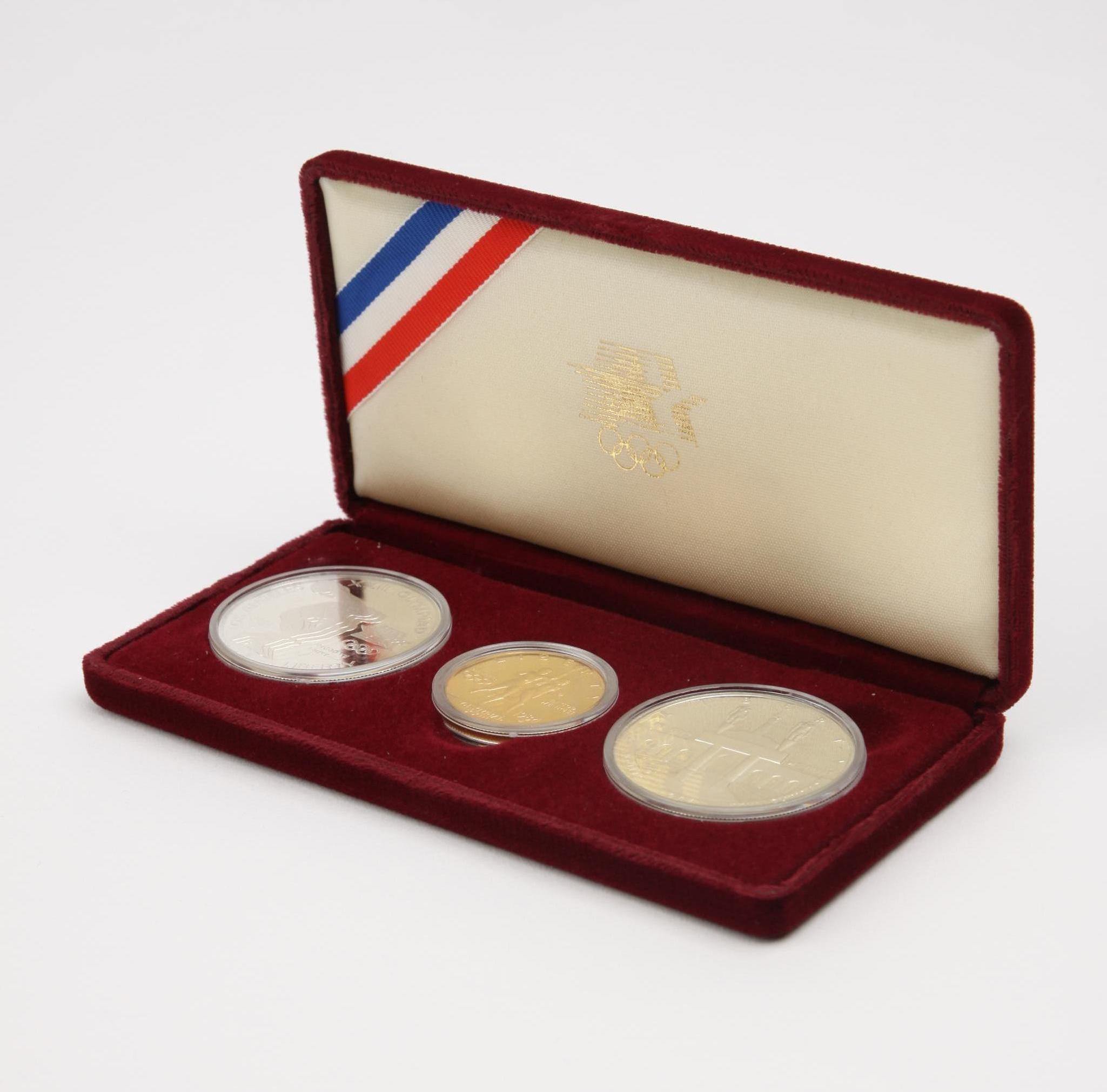 Appraisal: THREE OLYMPIC GOLD AND SILVER COINS Set of three United