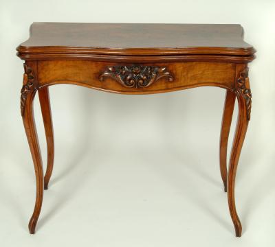 Appraisal: A LOUIS XVI STYLE WALNUT CARD TABLE of oblong serpentine