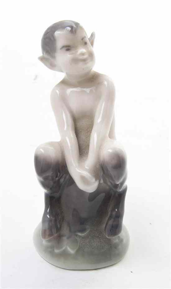 Appraisal: A Royal Copenhagen Porcelain Figure depicting a Faun seated on