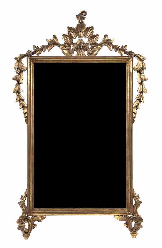 Appraisal: An Italian Carved Giltwood Mirror having a foliate and basket