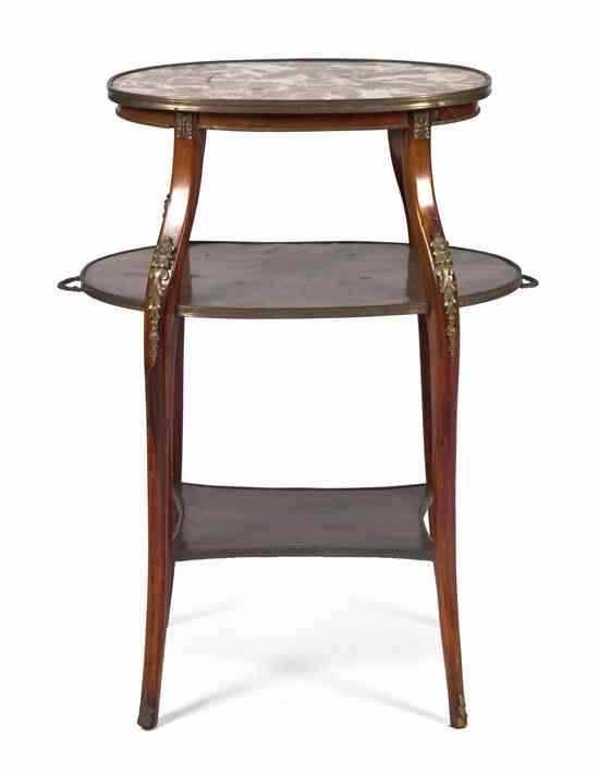 Appraisal: A French Tiered Side Table of oval form the top