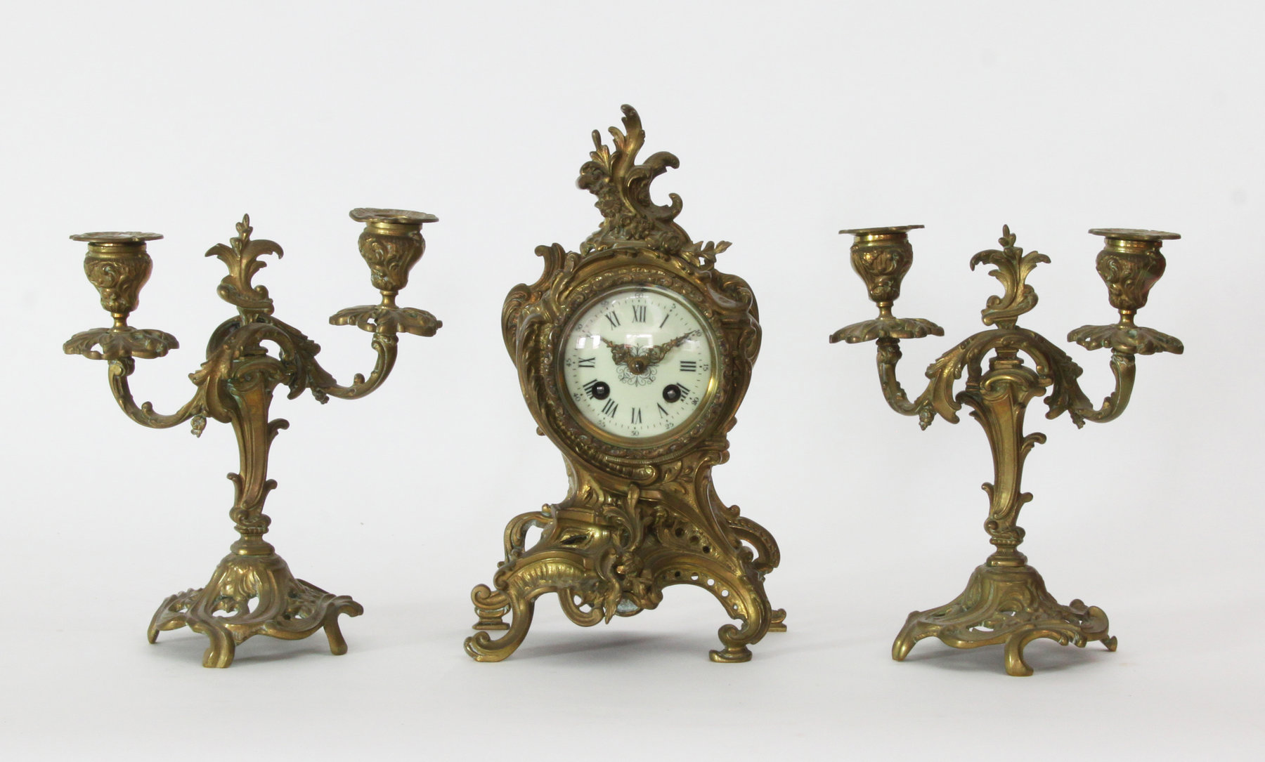 Appraisal: A clock garniture set comprising a clock in a gilt