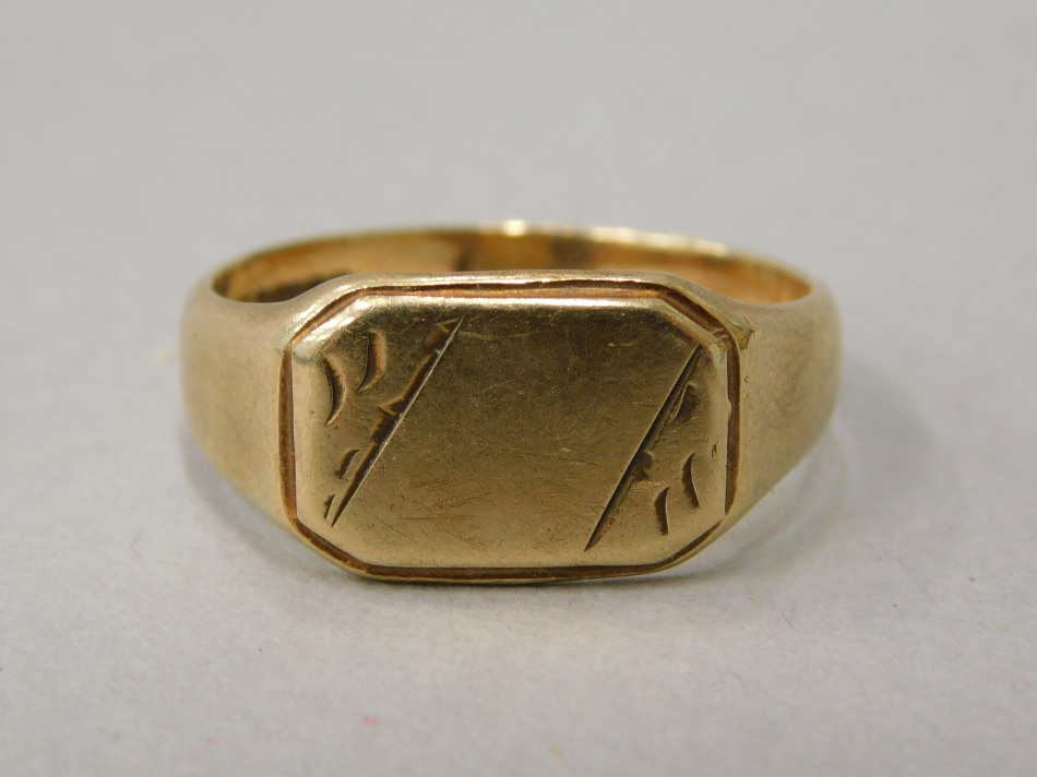 Appraisal: A ct gold signet ring with florally engraved rectangular shield