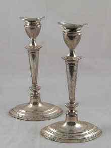 Appraisal: A pair of Adam style silver candlesticks cm high Birmingham