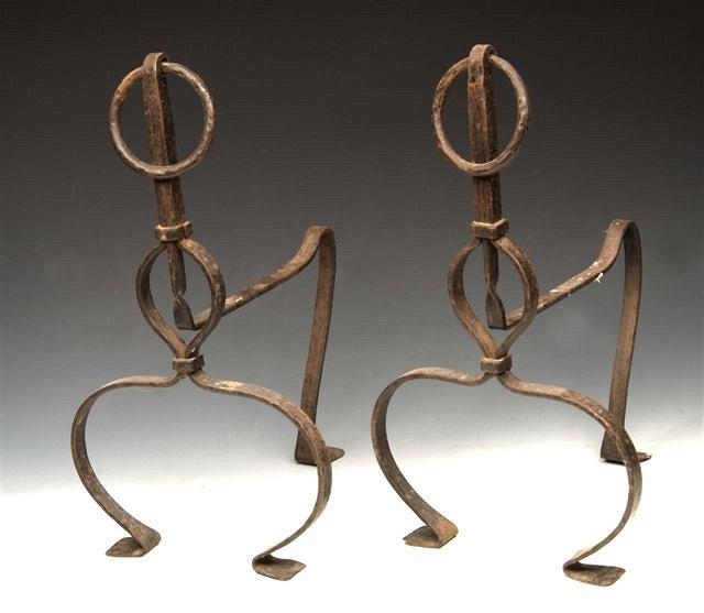 Appraisal: A PAIR OF WROUGHT IRON FIRE DOGS