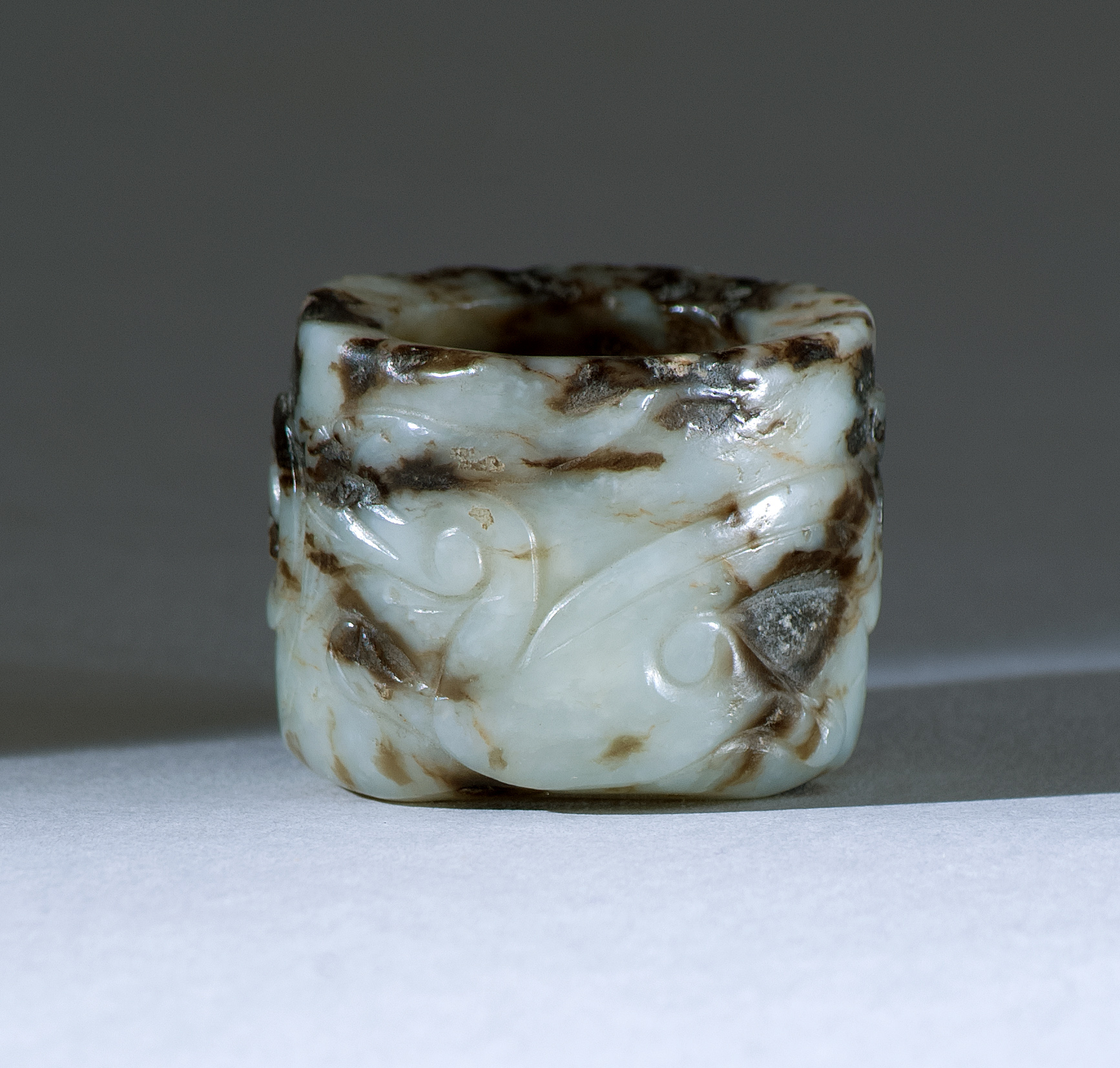 Appraisal: BLACK AND WHITE JADE ARCHER'S RING th CenturyCarved with a