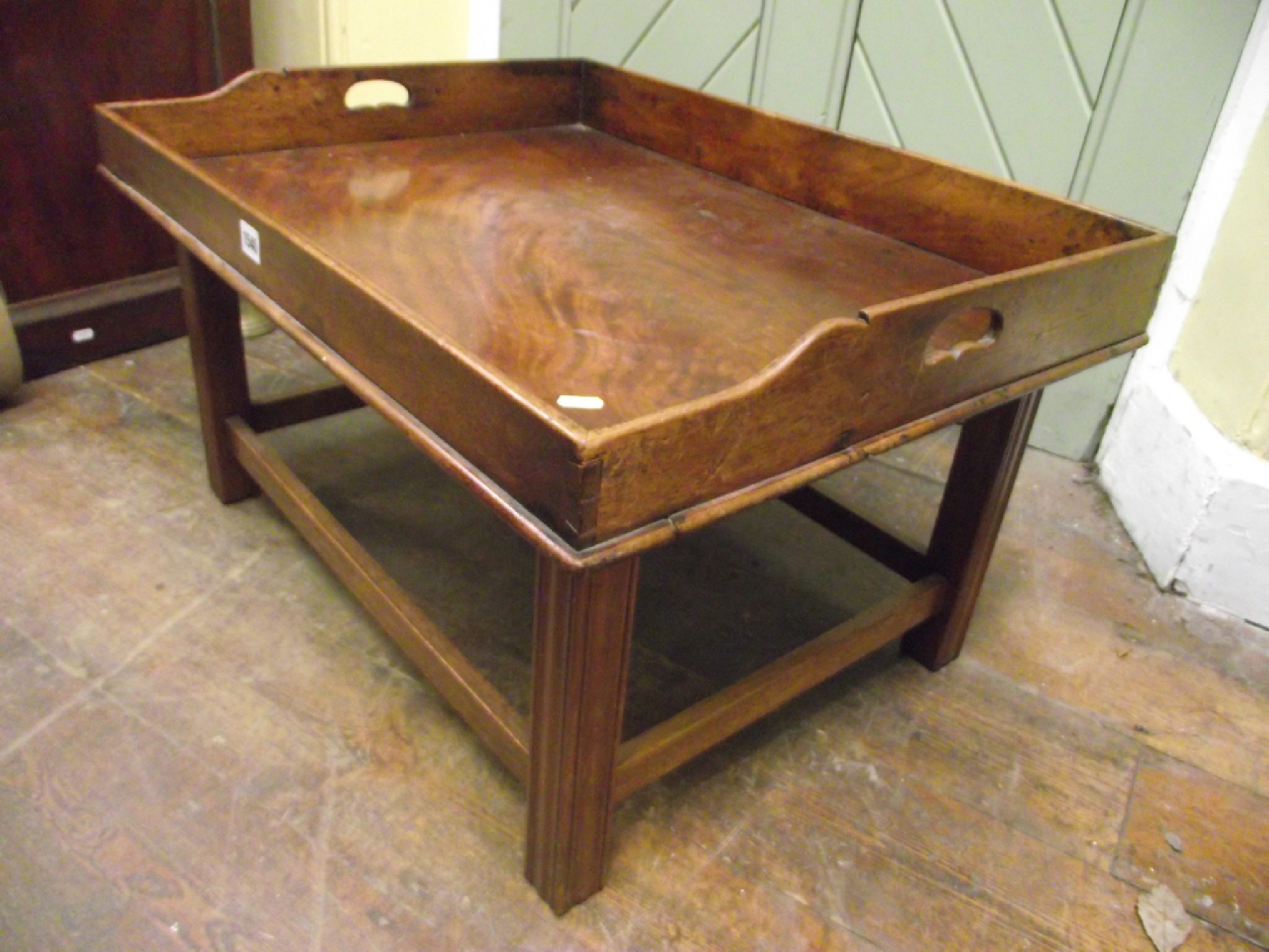 Appraisal: A th century mahogany butler's tray with three quarter gallery