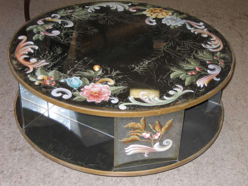 Appraisal: AMERICAN MIRRORED CIRCULAR COFFEE TABLE the antiqued glass painted with