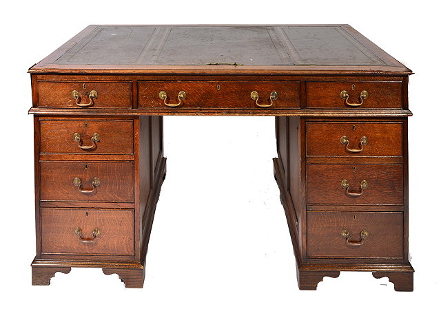 Appraisal: A LARGE OAK PEDESTAL DESK with green leather inset top