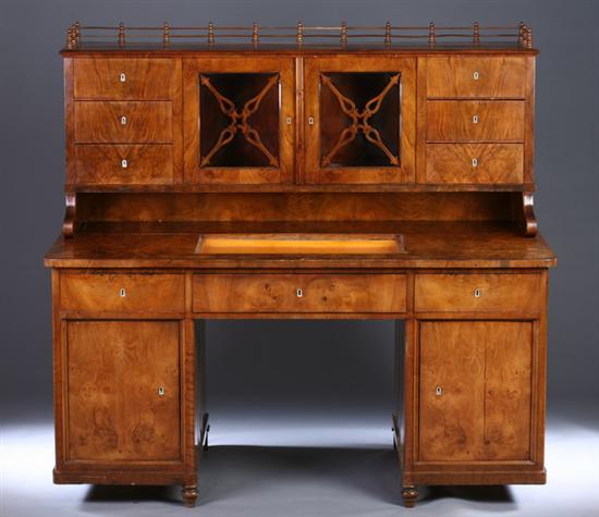 Appraisal: BIEDERMEIER BURLED WALNUT DOUBLE-PEDESTAL DESK th century Galleried superstructure with