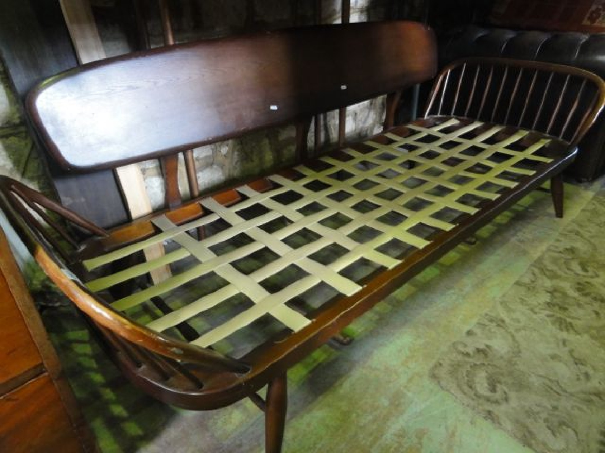 Appraisal: A vintage Ercol dark stained elm and beechwood sofa bed