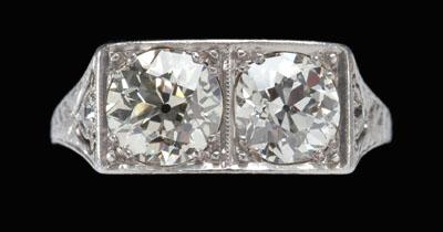 Appraisal: Platinum and diamond ring two central Old European-cut diamonds total