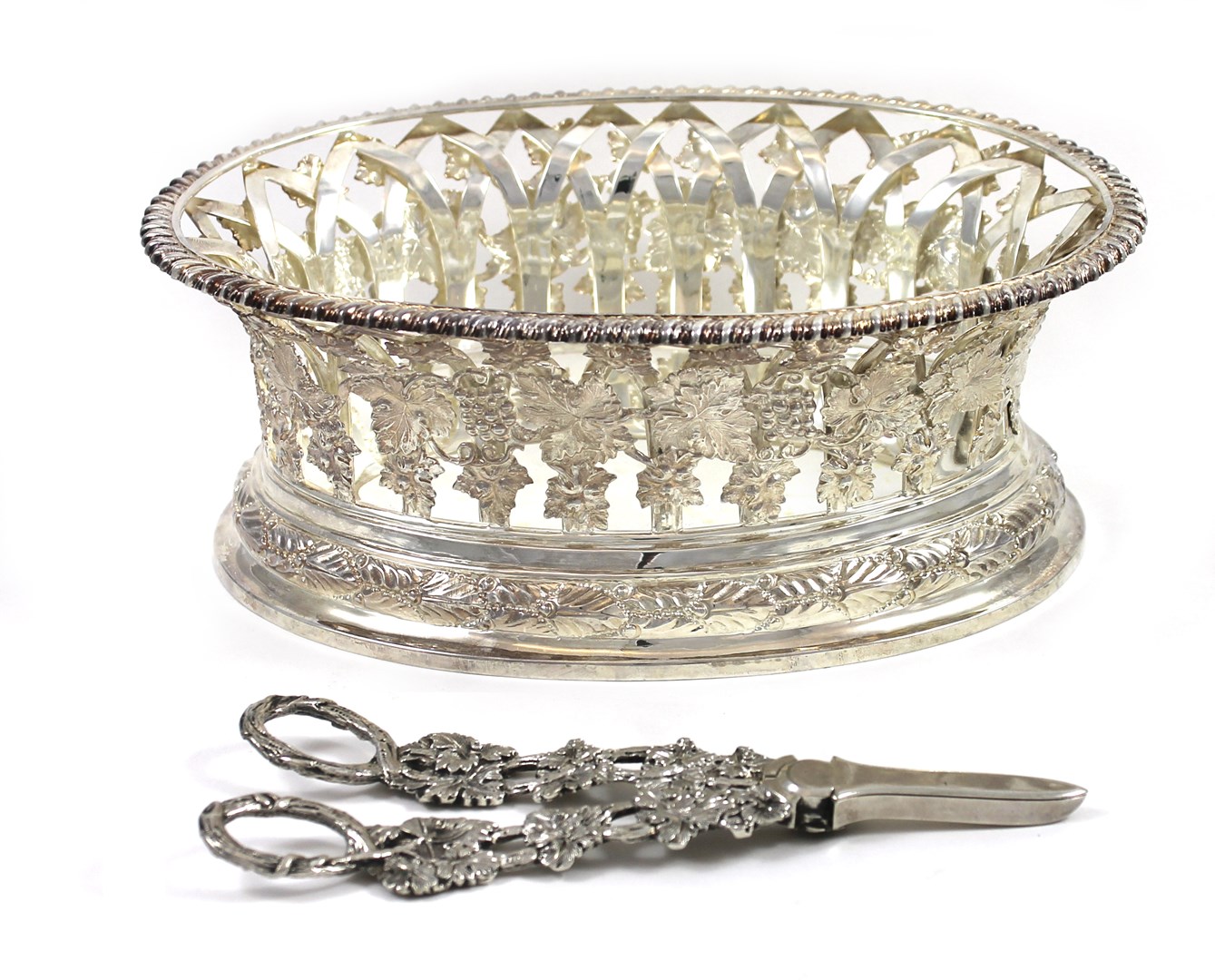 Appraisal: An Edwardian silver oval grape stand of basket form the