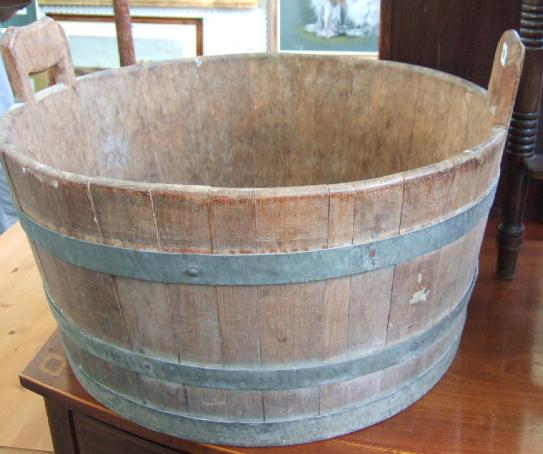 Appraisal: A coopered oak planter of barrel form with a pair