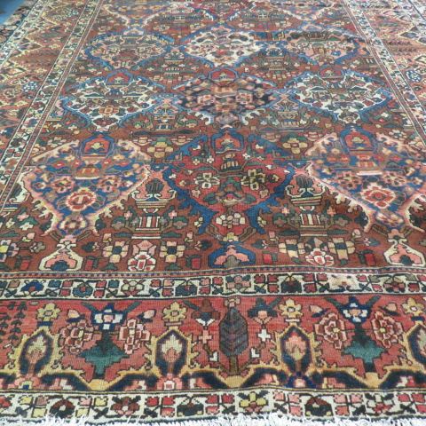 Appraisal: Bakhteiari Persian Handmade Rug stylized floral on deep earthtones '