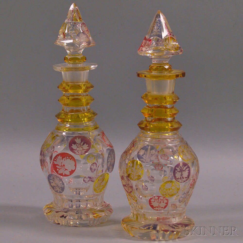 Appraisal: Two Etched Colored Glass Decanters with amethyst amber and cranberry