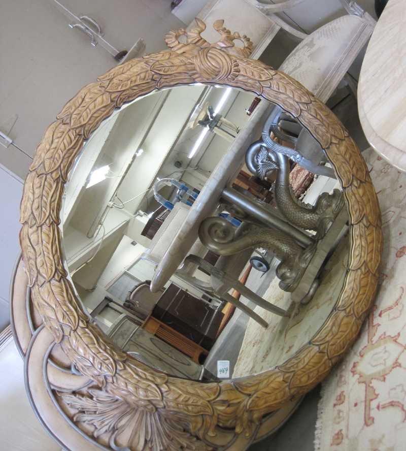 Appraisal: ROUND WALL MIRROR unmarked recent production featuring a leaf-molded frame