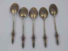 Appraisal: A set of five silver gilt teaspoons the finials minarets