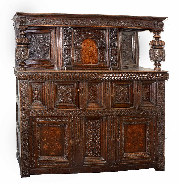 Appraisal: A th Century style carved oak court cupboardwith canted upper