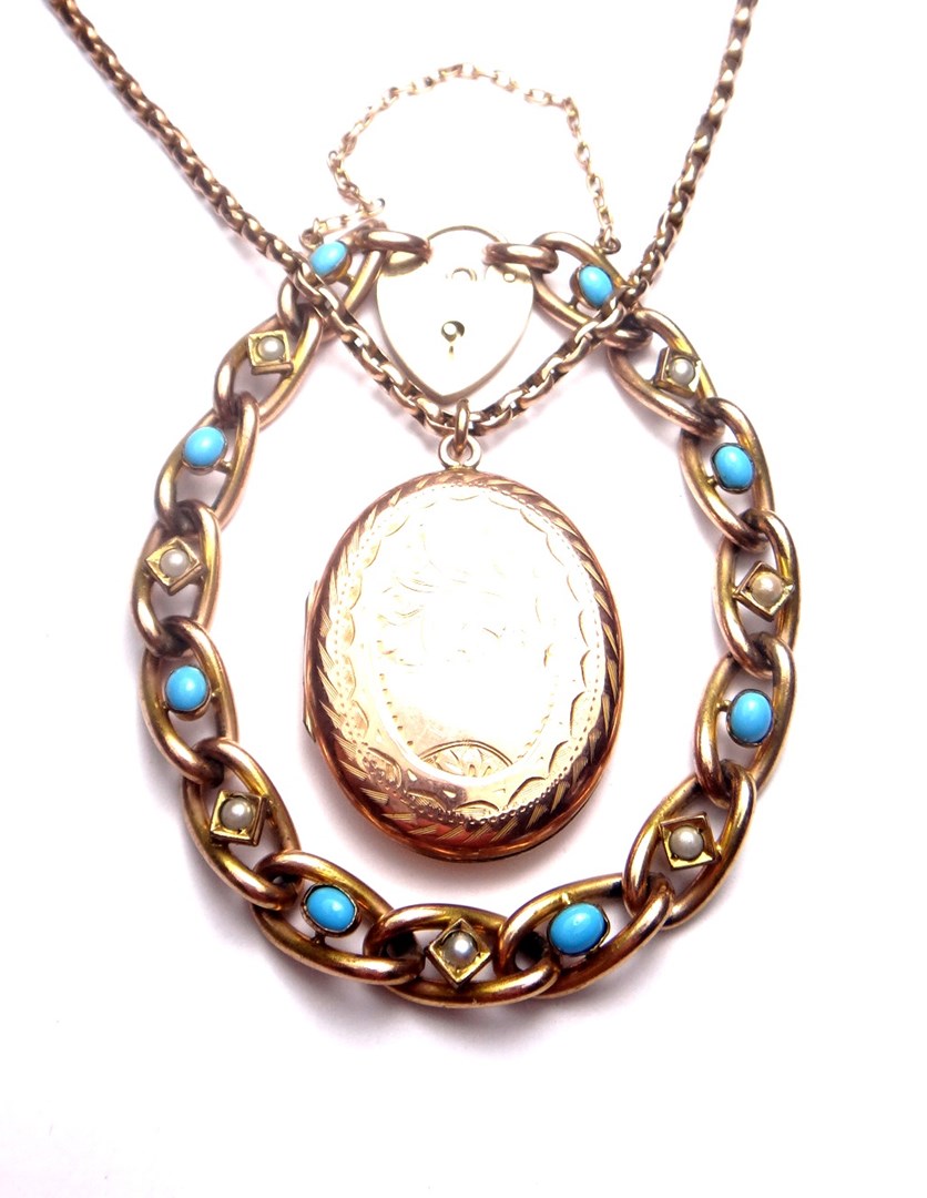 Appraisal: A gold back and front oval pendant locket with engraved