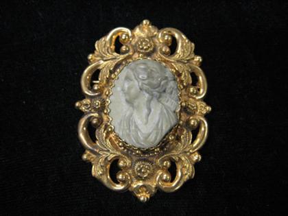 Appraisal: Lava cameo woman in sinistral profile large ornate gold frame