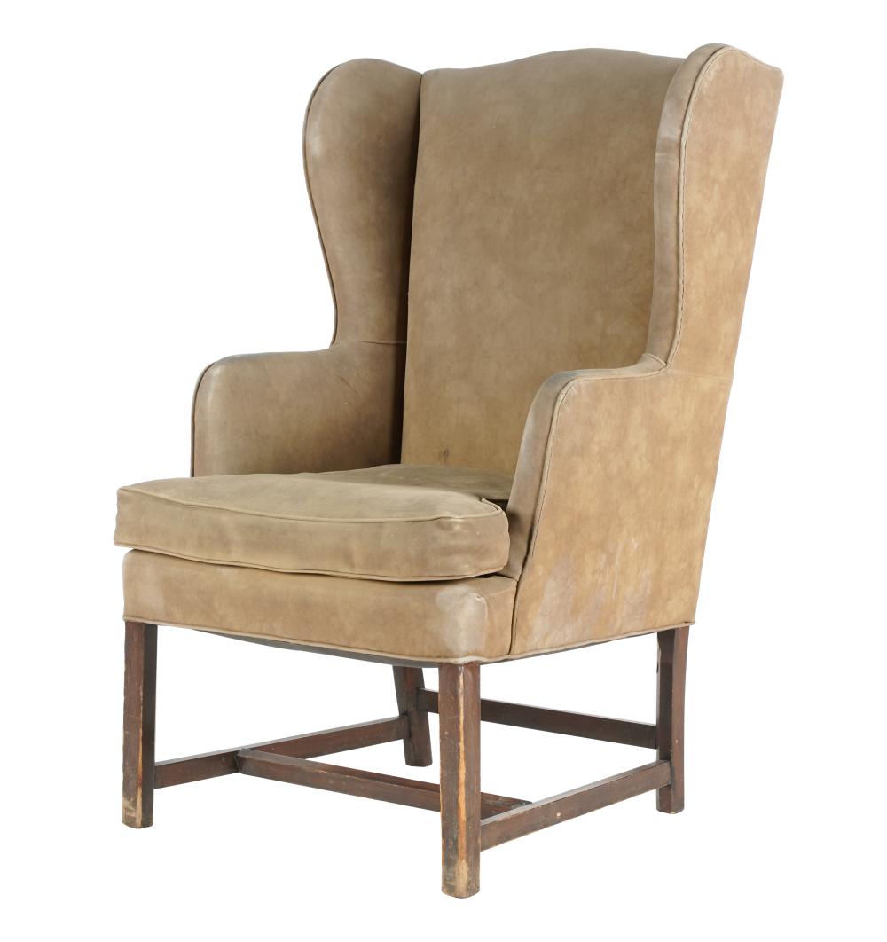 Appraisal: AMERICAN WINGBACK ARMCHAIRcovered with light brown suede inches wide inches