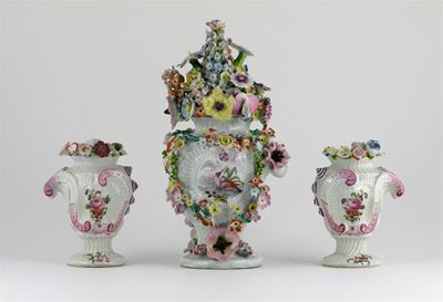 Appraisal: A Longton Hall garniture of rococo moulded vases the central