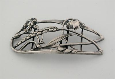 Appraisal: A German Art Nouveau buckle scrolling intertwined wild flowers and