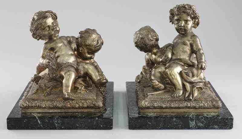 Appraisal: Pr Silvered bronze figural bookends of two putti one embracing