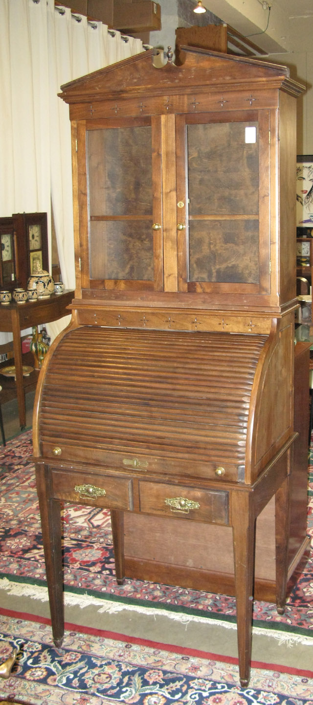 Appraisal: TAMBOUR-FRONT SECRETARY BOOKCASE American th century with cabinet bookcase surmounting