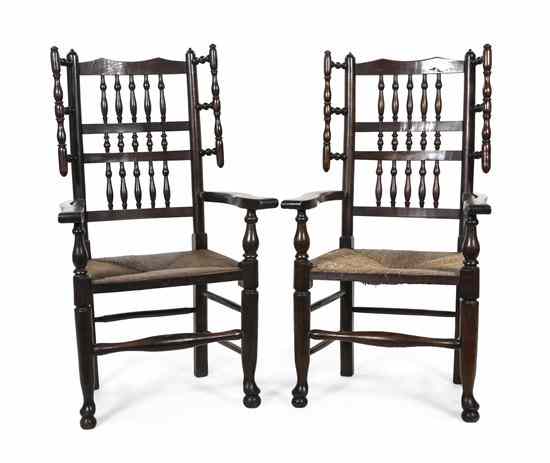 Appraisal: A Pair of English Oak Open Armchairs each having a