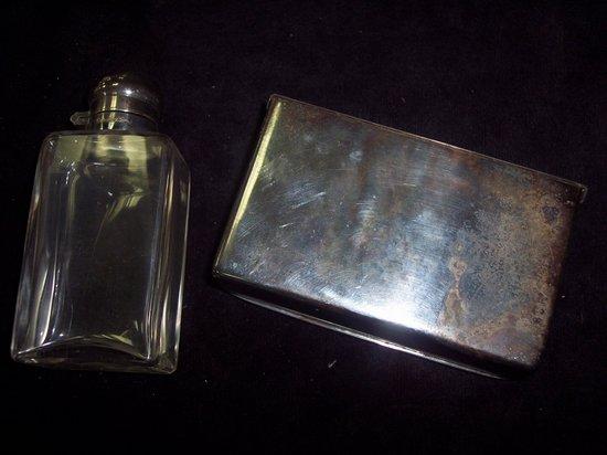 Appraisal: A saddle box fitted a flask with plated stopper and