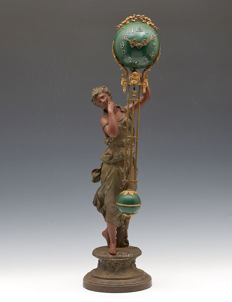 Appraisal: Ansonia Victorian swinger clock with spelter figure Ansonia Victorian swinger