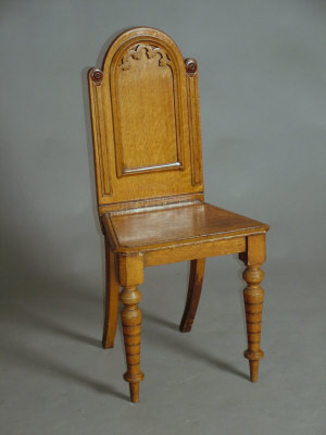 Appraisal: A Victorian blonde oak hall chair the arched and moulded