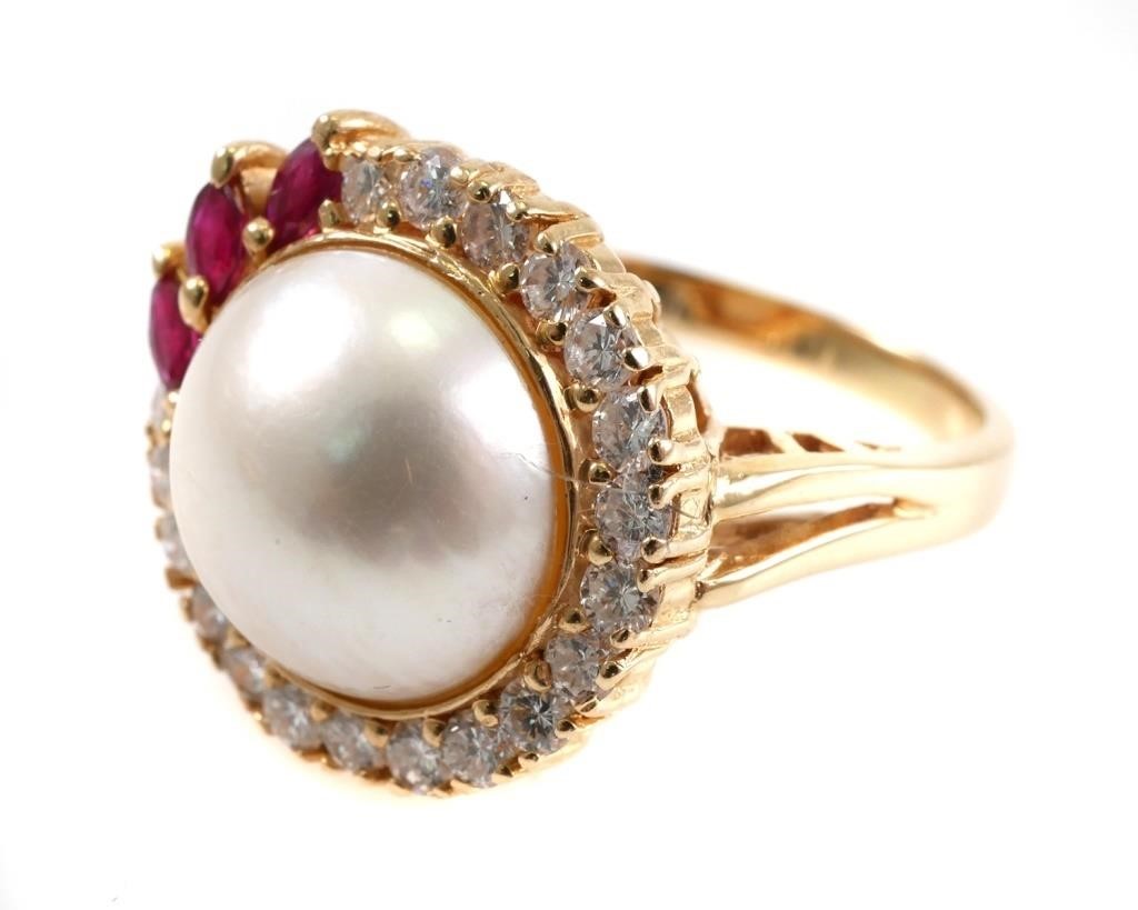 Appraisal: Large central pearl with marquise cut accent rubies and round