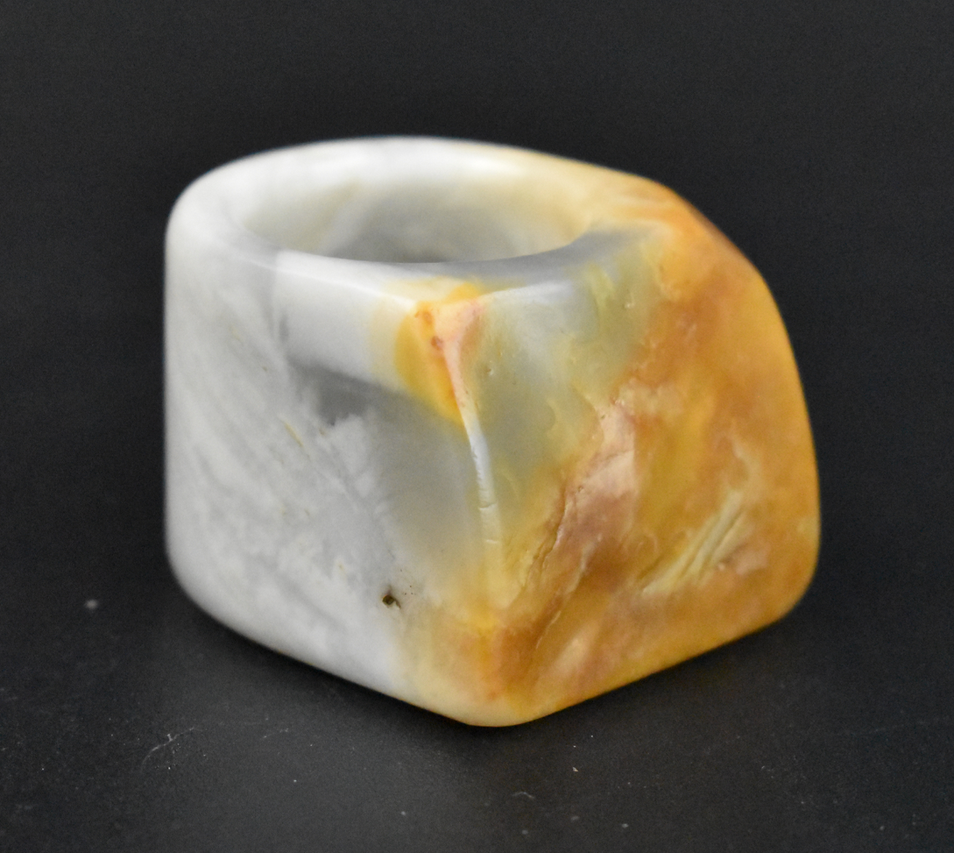 Appraisal: A Chinese jade carved archer ring dating from the Qing